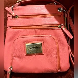 mini Nicole miller orange purse.